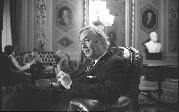 Ambassador Daniel Patrick Moynihan seated in the United Nations Security Council listening to the debates on the Middle East. (1976) 