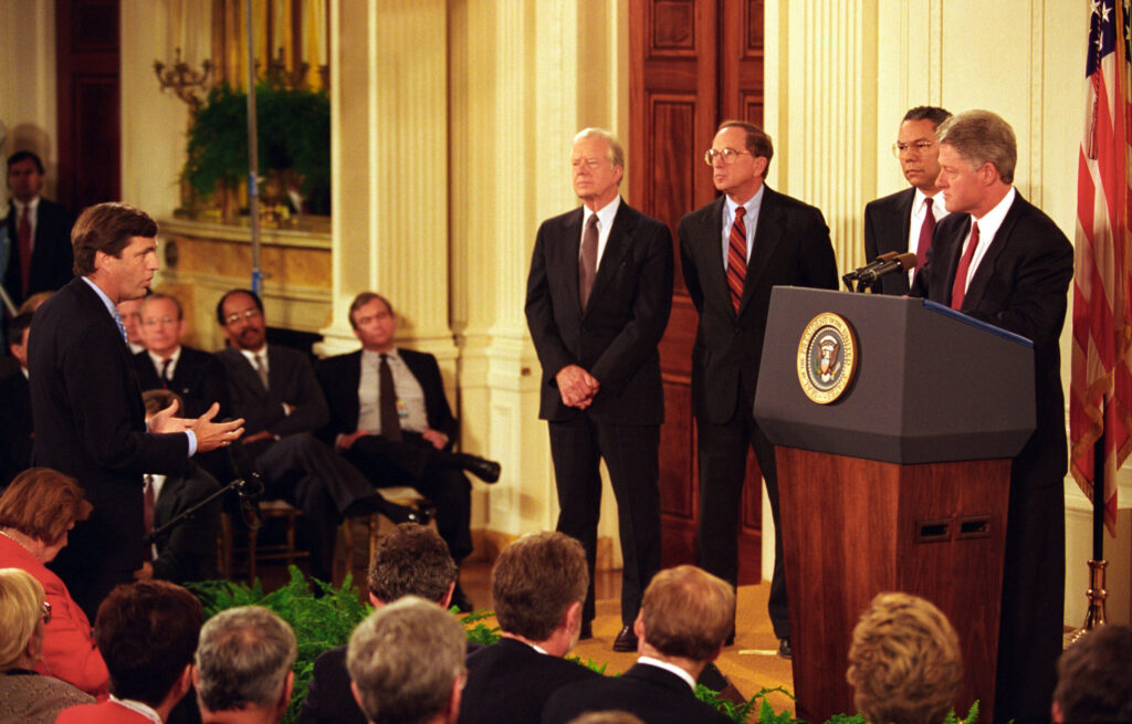 President Bill Clinton and the U.S. Delegation to Haiti hold a press conference in the East Room related to the status of U.S. & Haiti relations in 1994. (Public Domain) 