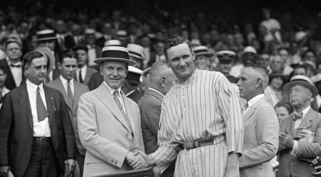 Calvin Coolidge shaking hands with Washington Senators pitcher Walter Johnson in 1925. (Library of Congress) 